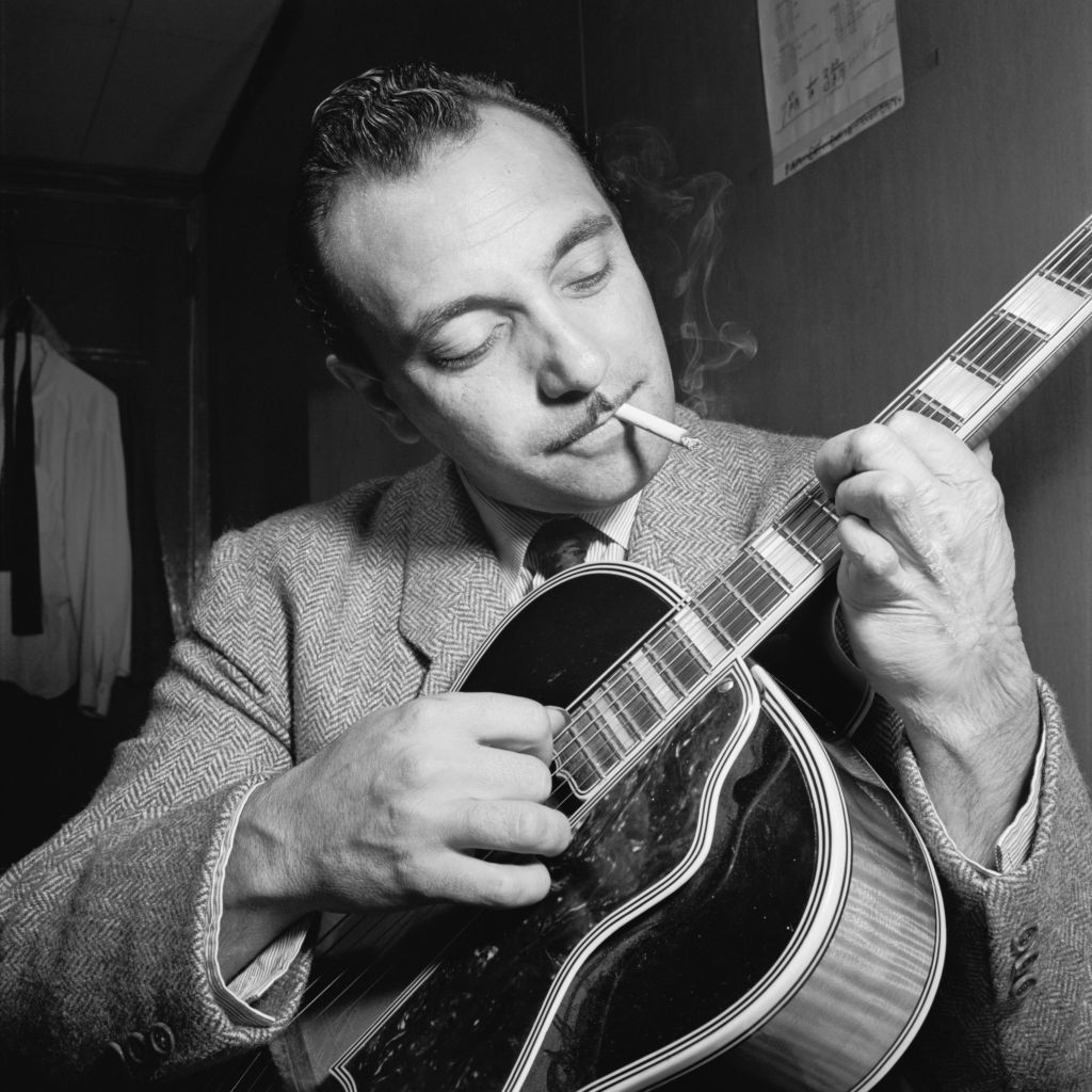 Django Reinhardt at the Aquarium jazz club in New York, NY by  William P. Gottlieb (Gottlieb_07301), CC0 Public Domain Dedication